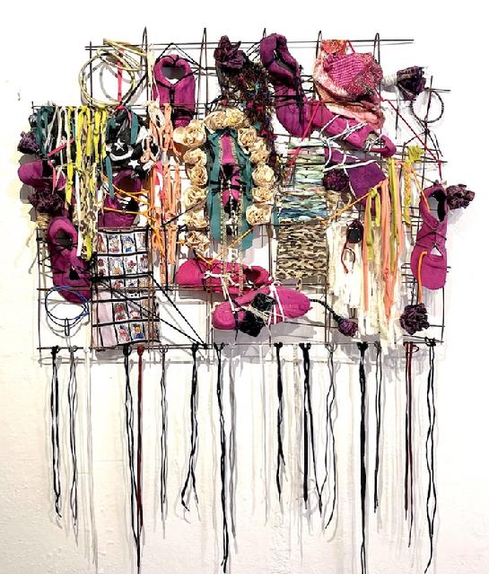 textile art on wire grid